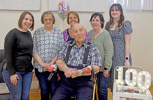 Ramer Fassnacht (center) celebrated his 100th birthday on March 4. Celebrating with him, from left, are his granddaughter, Katie Elder, daughters Glenell Ratzlaff,  Joleen Gustafson and Teresa Elder-Smith and granddaughter Lizzy Smith.