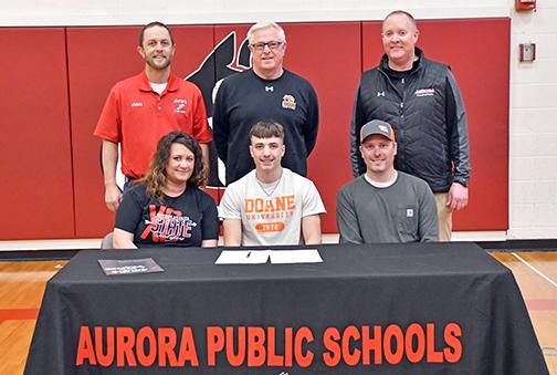 Lucas Gautier signed a letter of intent to run track and field at Doane University March 5 alongside his parents, Jessica Gautier and Chad Salmon, Aurora cross country coach Tony Sigler, Doane track coach Ed Fye and Aurora track coach Gordon Wilson.  