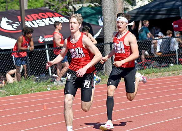 Aurora’s Charlie Evans has the slight edge over teammate Lucas Gautier during the second lap of the 800 run at last week’s Central Conference meet in Crete. Evans and Gautier finished 1-2 in the event. 