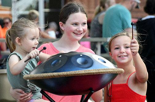 The Explorit-Zone was a popular spot for kids and their families to try out all the gizmos and instruments brought by the Edgerton Center Thursday night. Three girls played a melody on a sonic energy sensory handpan.