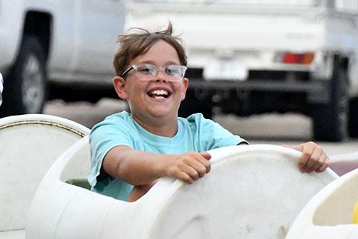 Michael Vetter was one of several smiling kids who took a ride on the Aurora Rotary Club kiddie train rides.