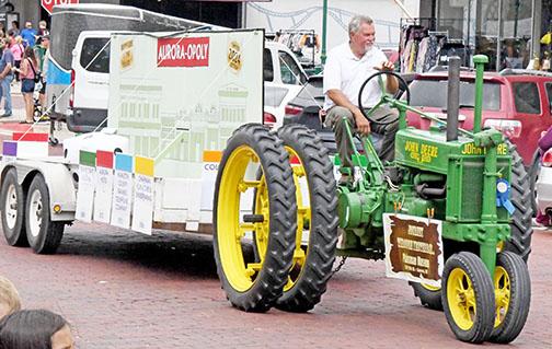 The Plainsman Museum took first place in the Antique division of the A’ROR’N Days parade with its “Aurora-opoly” float pulled by a vintage John Deere tractor. 